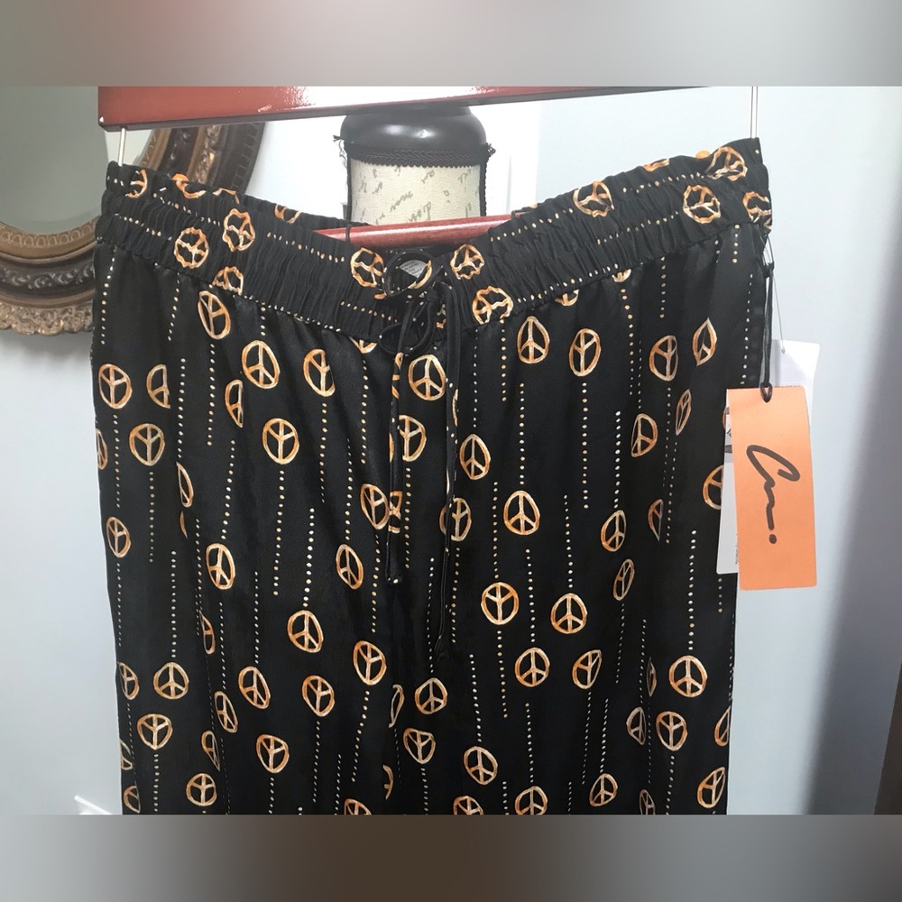 Nordstrom Black Pants with Gold Peace Signs by Cristina Martinez